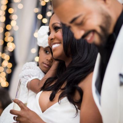 Photo of Keshia Knight Pulliam and her husband, Brad James during their engagement ceremony.